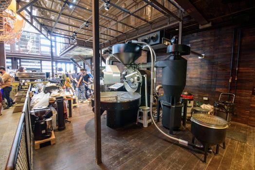 Bangkok, Thailand - 16 September, 2020:  A big of modern Coffee grinder in NANA Hunter Coffee Roasters coffee cafe