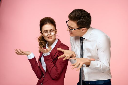 business man and woman office work colleagues team office management studio pink background. High quality photo