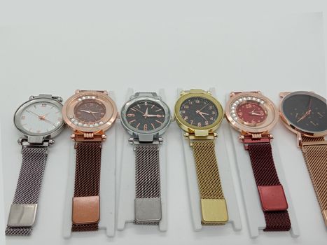 multiple colored watch stock on gray background