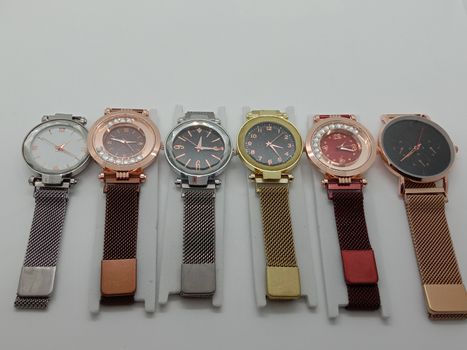 multiple colored watch stock on gray background