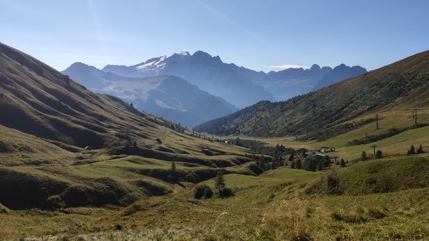 Val Gardena, Italy - 09/15/2020: Scenic alpine place with magical Dolomites mountains in background, amazing clouds and blue sky in Trentino Alto Adige region, Italy, Europe