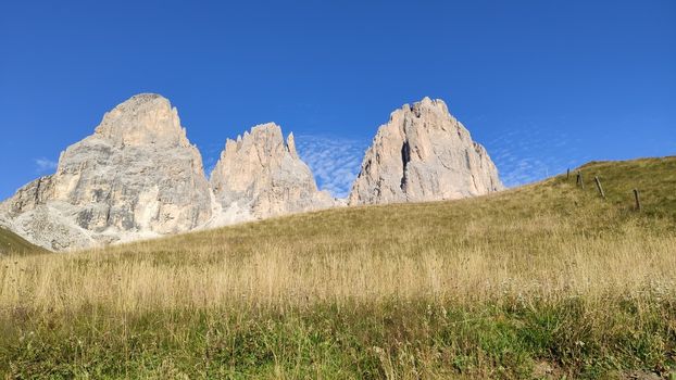 Val Gardena, Italy - 09/15/2020: Scenic alpine place with magical Dolomites mountains in background, amazing clouds and blue sky in Trentino Alto Adige region, Italy, Europe