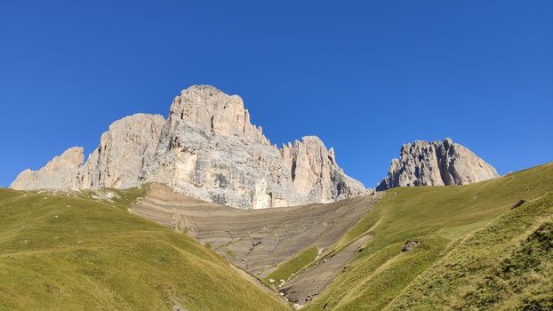 Val Gardena, Italy - 09/15/2020: Scenic alpine place with magical Dolomites mountains in background, amazing clouds and blue sky in Trentino Alto Adige region, Italy, Europe