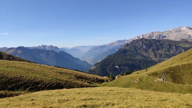 Val Gardena, Italy - 09/15/2020: Scenic alpine place with magical Dolomites mountains in background, amazing clouds and blue sky in Trentino Alto Adige region, Italy, Europe