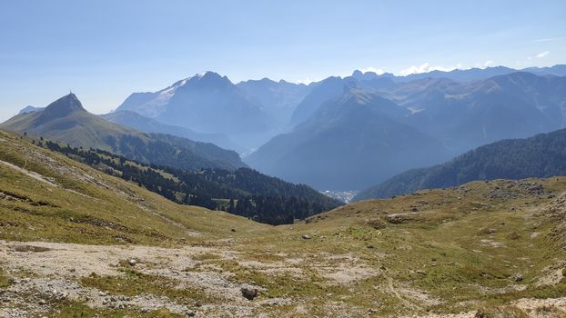 Val Gardena, Italy - 09/15/2020: Scenic alpine place with magical Dolomites mountains in background, amazing clouds and blue sky in Trentino Alto Adige region, Italy, Europe