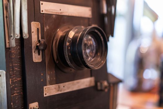 Vintage, antique large format camera in blurred background.