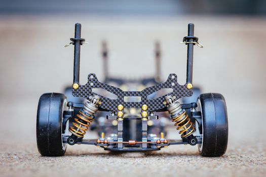 RC car chassis and parts being built to form a radio controlled race car.