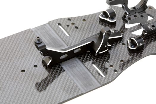 RC car chassis and parts being built to form a radio controlled race car.