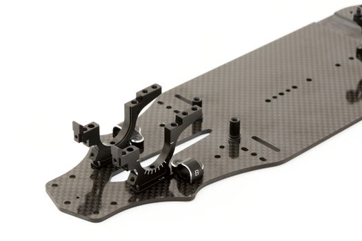 RC car chassis and parts being built to form a radio controlled race car.