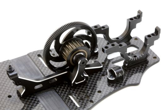 RC car chassis and parts being built to form a radio controlled race car.