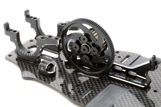 RC car chassis and parts being built to form a radio controlled race car.