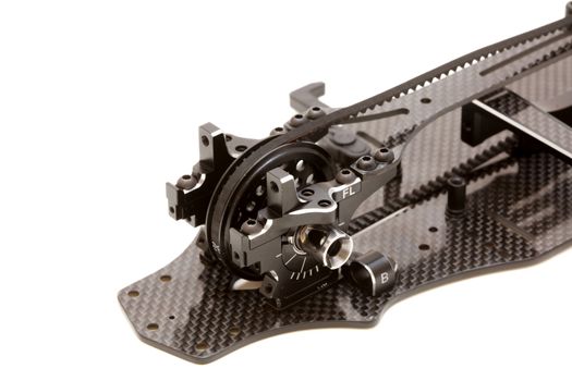 RC car chassis and parts being built to form a radio controlled race car.