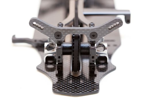 RC car chassis and parts being built to form a radio controlled race car.