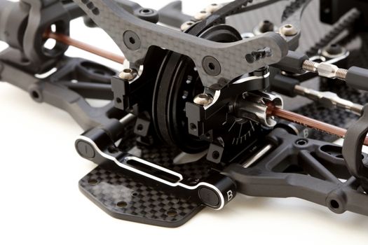 RC car chassis and parts being built to form a radio controlled race car.