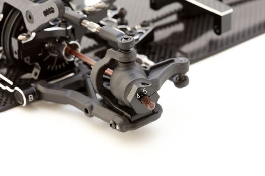 RC car chassis and parts being built to form a radio controlled race car.