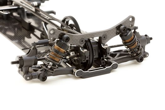 RC car chassis and parts being built to form a radio controlled race car.