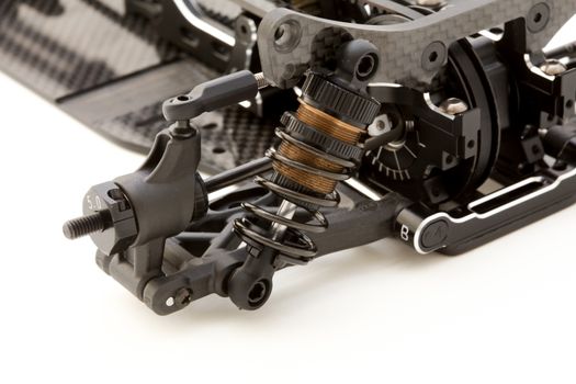RC car chassis and parts being built to form a radio controlled race car.