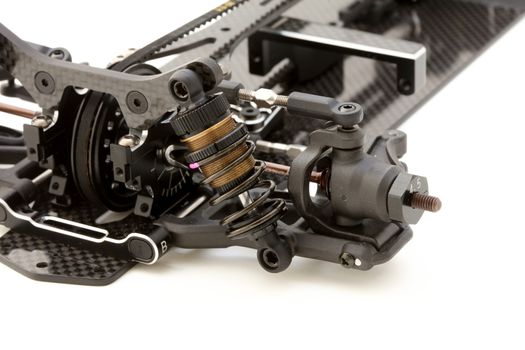 RC car chassis and parts being built to form a radio controlled race car.
