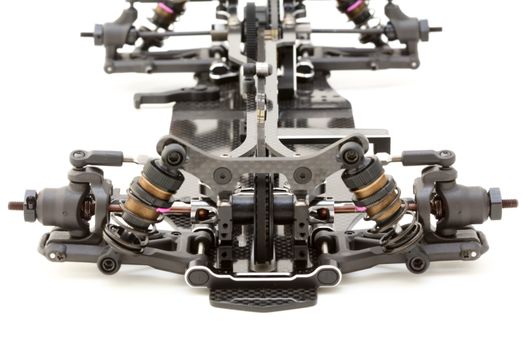 RC car chassis and parts being built to form a radio controlled race car.