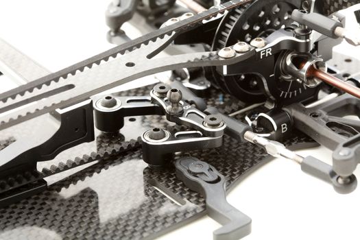 RC car chassis and parts being built to form a radio controlled race car.