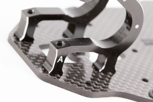 RC car chassis and parts being built to form a radio controlled race car.