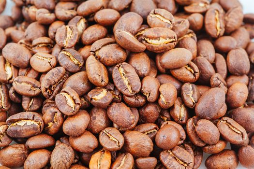 A close up shot of a pile of coffee beans
