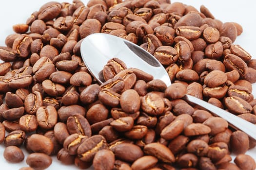 A close up shot of a pile of coffee beans