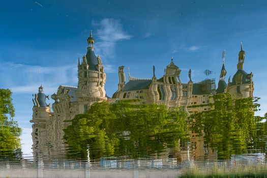 Beautiful fairytale castle in Schwerin, reflected in the lake.