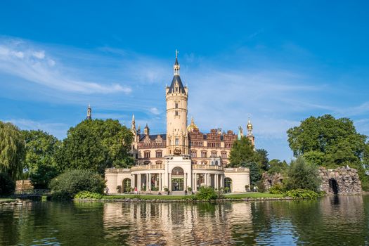 A beautiful fairy-tale castle in Schwerin, the view from the lake.