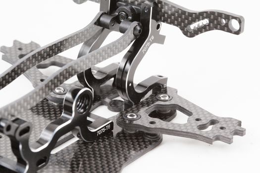 RC car chassis and parts being built to form a radio controlled race car.