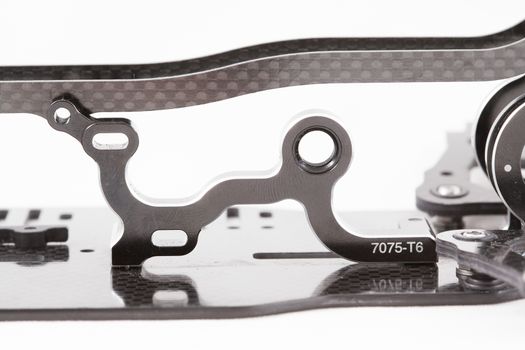 RC car chassis and parts being built to form a radio controlled race car.