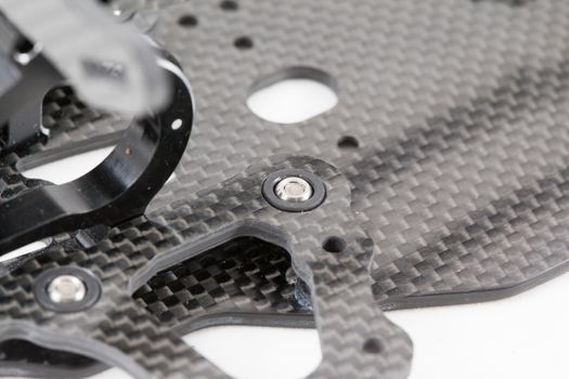 RC car chassis and parts being built to form a radio controlled race car.