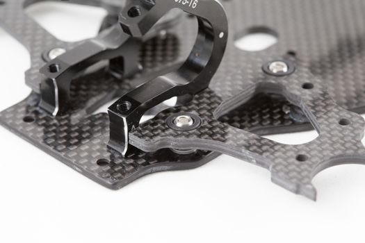 RC car chassis and parts being built to form a radio controlled race car.