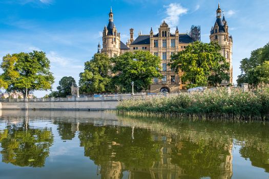 A beautiful fairy-tale castle in Schwerin, the view from the lake.