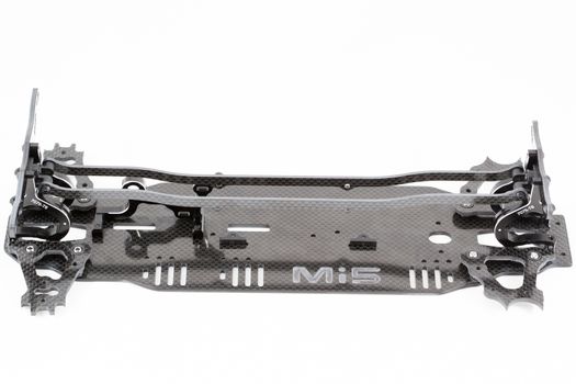 RC car chassis and parts being built to form a radio controlled race car.