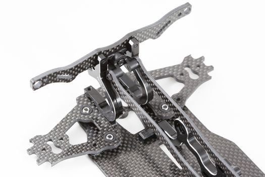 RC car chassis and parts being built to form a radio controlled race car.