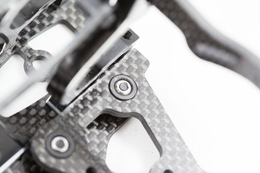 RC car chassis and parts being built to form a radio controlled race car.