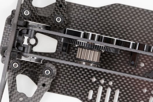 RC car chassis and parts being built to form a radio controlled race car.
