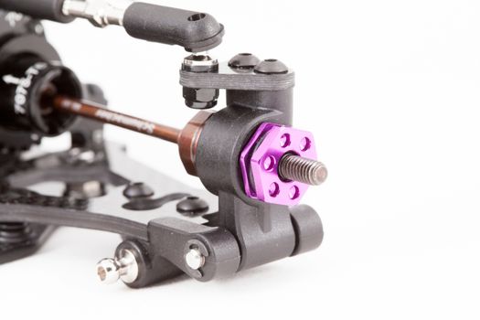 RC car chassis and parts being built to form a radio controlled race car.