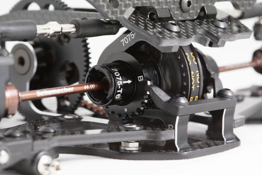 RC car chassis and parts being built to form a radio controlled race car.