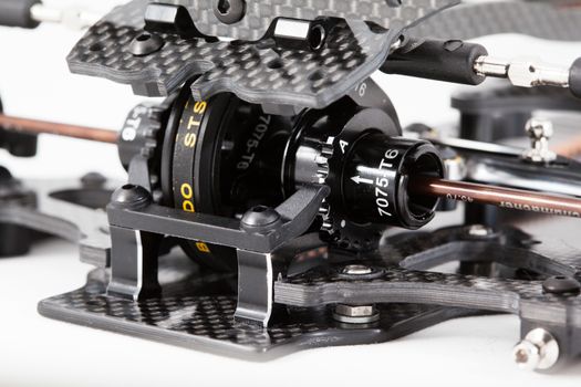 RC car chassis and parts being built to form a radio controlled race car.