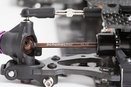 RC car chassis and parts being built to form a radio controlled race car.