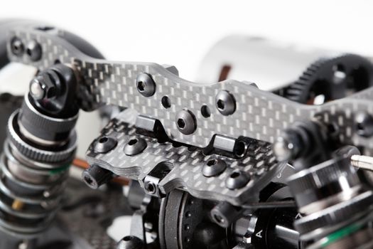 RC car chassis and parts being built to form a radio controlled race car.