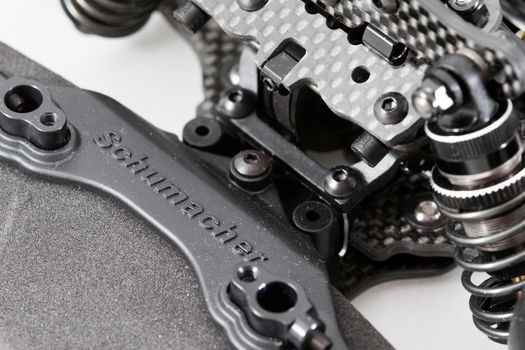 RC car chassis and parts being built to form a radio controlled race car.