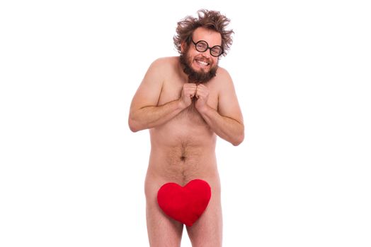 Happy Valentines Day. Crazy bearded Man with funny Haircut in eye Glasses. Happy and silly guy in Love, isolated on white background. Cheerful naked man with Red plush Heart.