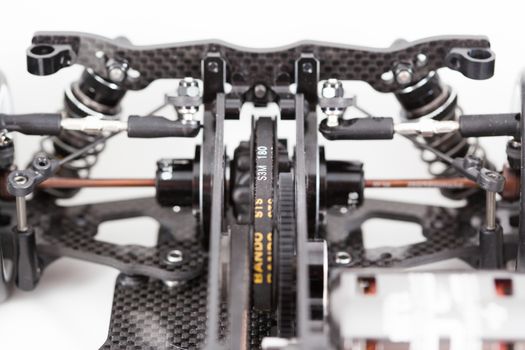 RC car chassis and parts being built to form a radio controlled race car.