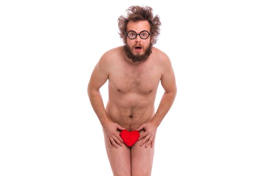 Happy Valentines Day. Crazy bearded Man with funny Haircut in eye Glasses. Happy and silly guy in Love, isolated on white background. Cheerful naked man with Red plush Heart.