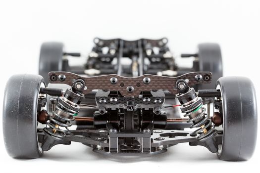RC car chassis and parts being built to form a radio controlled race car.