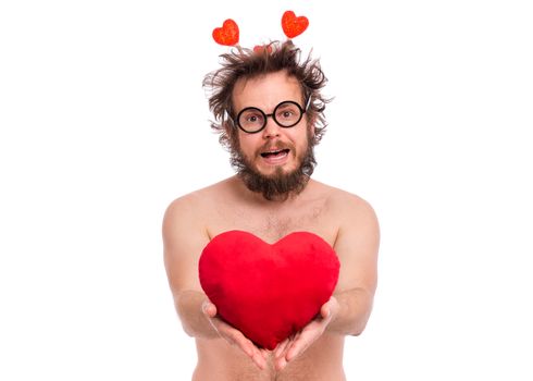 Happy Valentines Day. Crazy bearded Man with funny Haircut in eye Glasses. Happy and silly guy in Love, isolated on white background. Cheerful naked man with Red plush Heart.