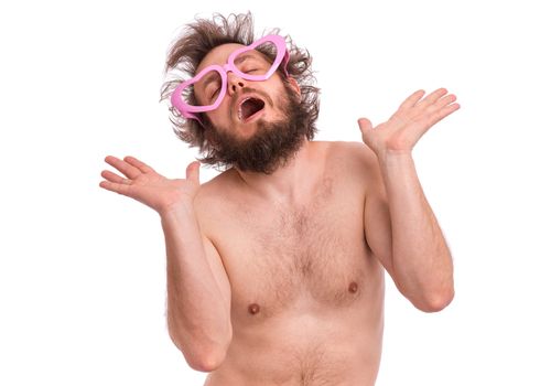 Happy Valentines Day. Crazy bearded Man with funny Curly Hair in heart shaped eye Glasses. Happy and silly guy in Love, isolated on white background. Portrait of Cheerful man.